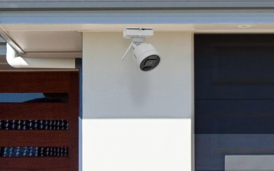 wire-free security camera on house